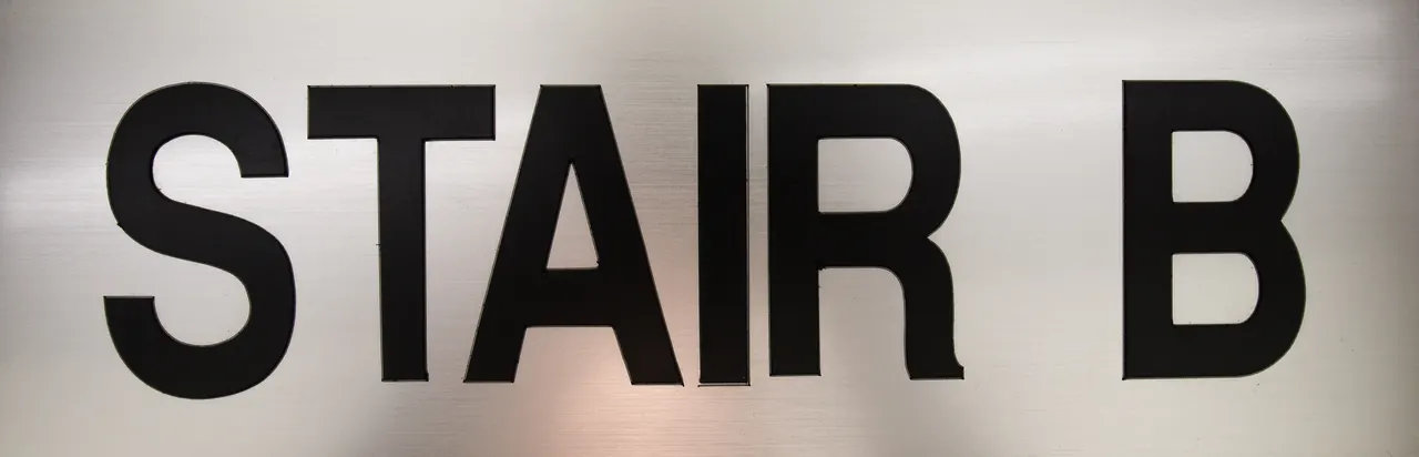 Brushed aluminium stairwell sign reading stair B