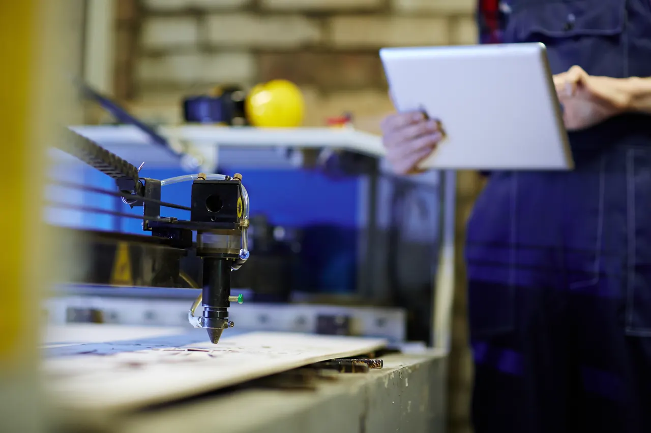 Laser engraving machine head over a workpiece
