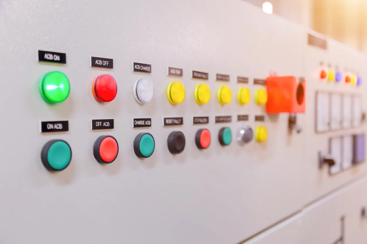 Control panel with push buttons identified by small engraved labels